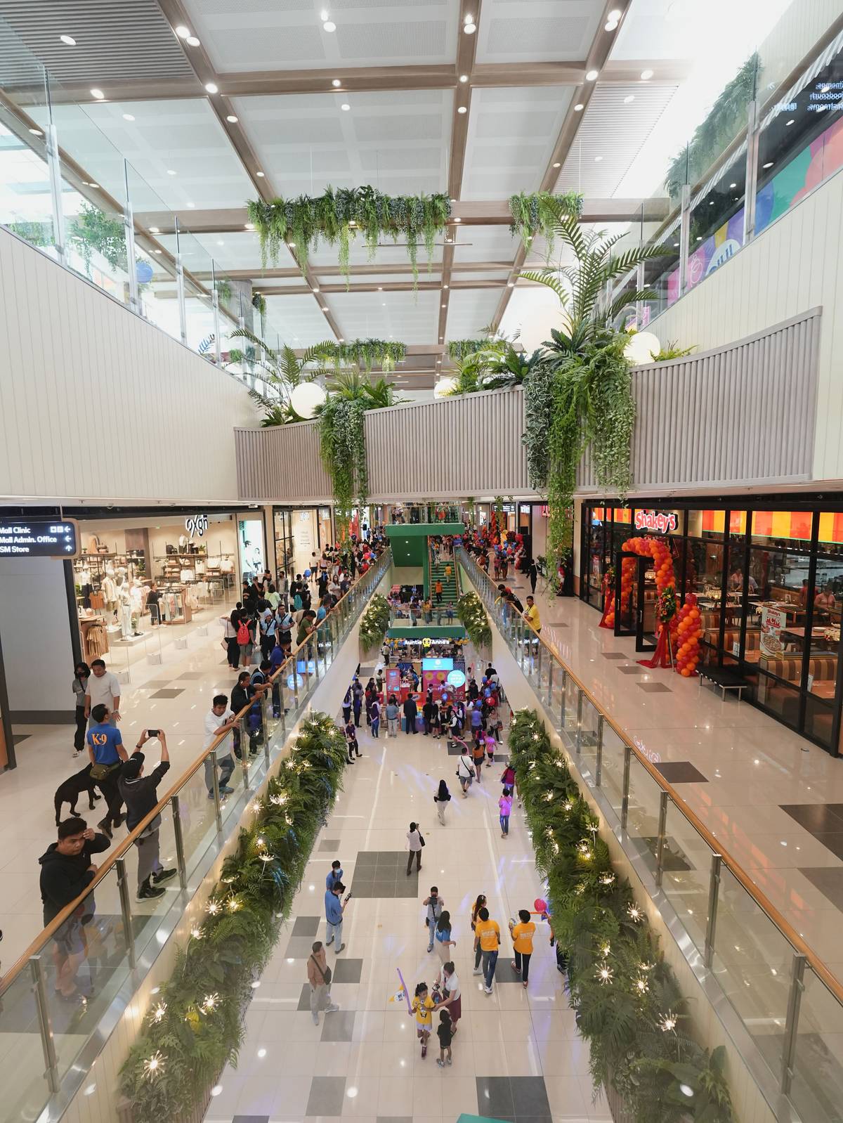 The mall’s interior is abundant in greenery and natural light.